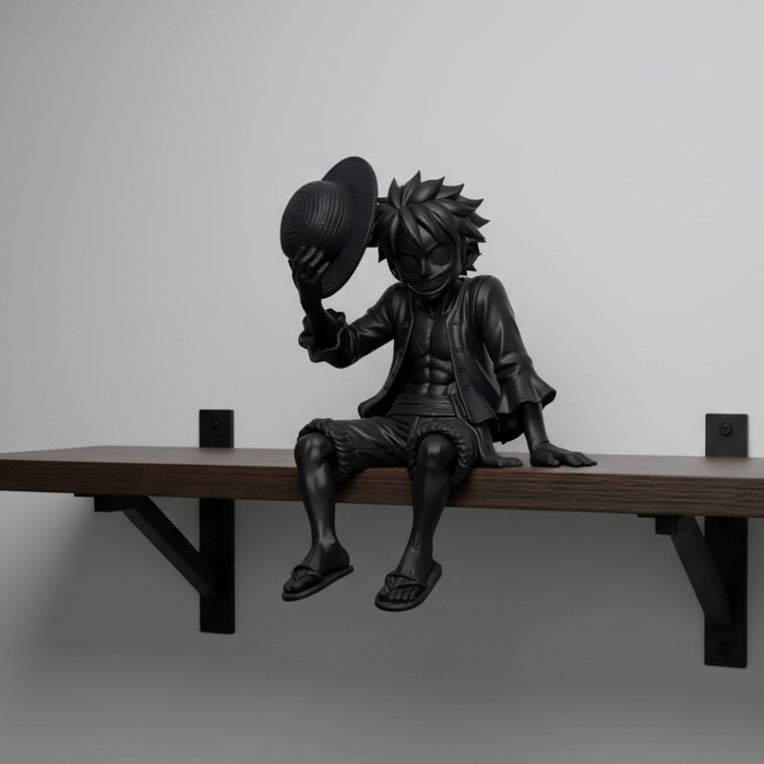 Ultra-matte black figurine on a concrete wall